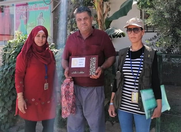 Garden of the Month winner Felroz (centre) with Lemon Tree Trust staff, Rizgari neighborhood of Domiz camp, Kurdistan Region of Iraq